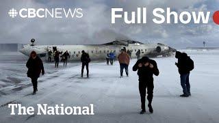 CBC News: The National | Plane crashes, flips over at Toronto airport