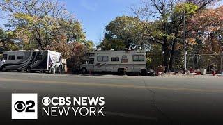 Bronx street lined with abandoned vehicles, RVs