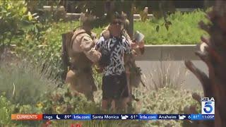 U.S. Marines arrive in L.A., Army veteran detained temporarily