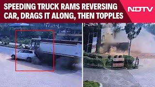 Karnataka News | Speeding Truck Rams Reversing Car, Drags It Along, Then Topples