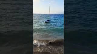 Wayfarer dinghy on waves