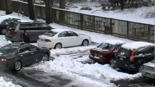 My neighbor is getting her car out of parking space.