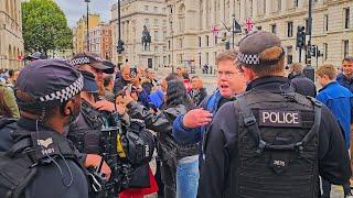 POLICE REMOVE RACIST INVESTIGATOR IDIOT WHO SUGGESTS THROWING THINGS at Horse Guards!