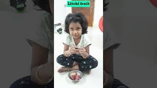 Anshu enjoying litchi fruit