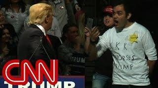 Trump stares down man in 'KKK' shirt