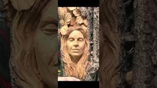 lady's face in wood carving