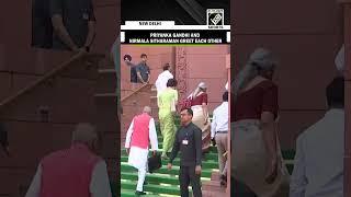 Priyanka Gandhi and Nirmala Sitharaman greet each other as they enter Parliament