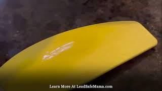 Using the glowing test kit to test a yellow silicone kitchen spatula (made by KitchenAid) for Lead