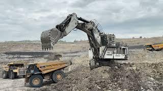 Big diger liebherr excavtor loading on cat 777 dumper