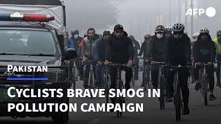 Cyclists brave Lahore smog in campaign against pollution | AFP