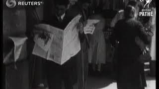 ITALY: PEOPLE BUYING NEWSPAPERS FROM BOOKSTALL IN ROME STREETS (1937)