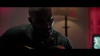 Sgt Will Gardner   Black man singing and playing guitar - Hotel scene