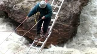 Harish Kapadia crossing the Rishi Ganga river en route Nanda Devi