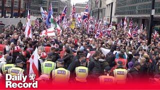 Tommy Robinson protest: Thousands gather in central London as activist remains in custody