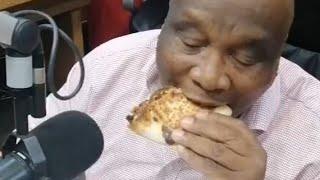 Ntate Thuso in studio enjoying Debonairs Pizza Wrap️