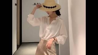 White silk blouse pairing golden satin skirt