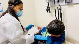 7 years old brave boy getting his flu shot cold weather flu shot time winter time stay safe