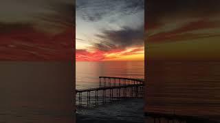 pink and orange sunset at the Ocean Beach Pier