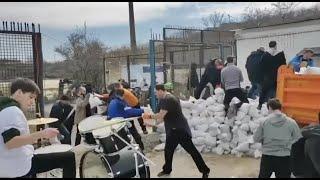 Ukrainians in Odessa fortifying their defenses and rocking out to Bon Jovi