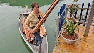 Girl prepares wood to make beds, tables and chairs. New life on the lake.