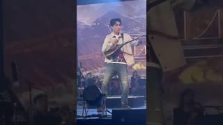 Dimash playing dombra at Olzhas's concert