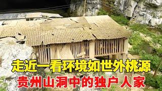 A cave was found in the deep mountains of Guizhou. A family lived in the cave. The environment was