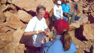 Matt Carpenter tags the summit in the Pikes Peak Marathon