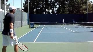 Mardy Fish practicing his return of serves against Jesse Levine at the 2009 LA Tennis Open.