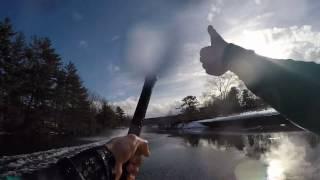 Snowmobile skimming while towing waterskier and barefooter