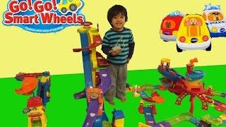 Kid playing with toys Vtech Go Go smart wheels toys