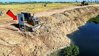 Good Heavy Machine Bulldozer Shantui DH17 C3 Pushing Dirt Into Black Water Resize Road