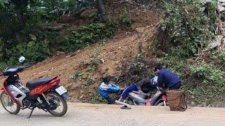 The girl was walking on the road when she saw the guy fall off his motorbike and called for help