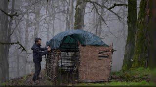 Surviving a Rainstorm While Camping: Cozy Shelter and Fireplace Building