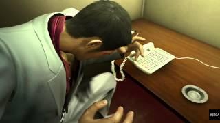 Kazuma Kiryu answers a telephone