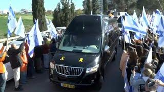 Crowds line the streets for funeral procession of Bibas family | AFP