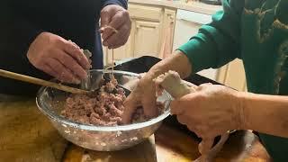 Stuffing The Meat Into The Casing As Manufacturing Potato Sausage For Christmas