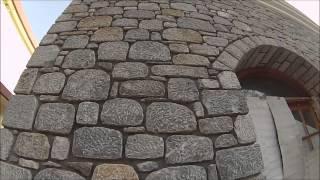 Building a house made of granite. Unique stone masonry