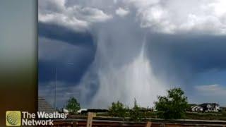 SPECTACULAR hail shaft takes over the Calgary, Alberta sky