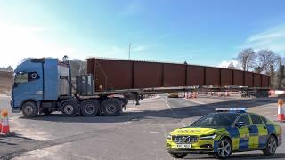 Police escort bridge abnormal loads to major road construction site