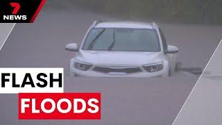 Heavy rain causes flash floods across Brisbane and the Redlands | 7NEWS