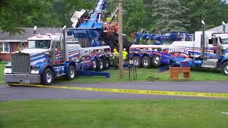 Removing crane from North Greenbush home