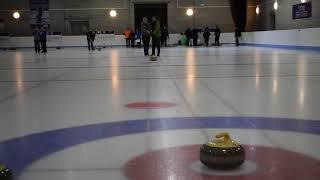 Blind centre user Kaz using a curling stick