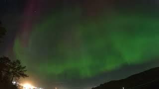 Epic aurora borealis dancing all over the night sky, obscured by (not so epic) clouds