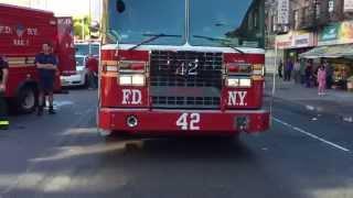 FDNY LADDER 42 TAKING UP BACKWARDS FROM 2 ALARM FIRE ON 138TH ST. IN THE SOUTH BRONX, NEW YORK CITY.