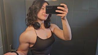 Beautiful muscular woman flexing muscles