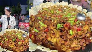 A Chinese Guy Cook Free Meals / Pork Potato Meat Noodles Food for the old on the Street in a Village