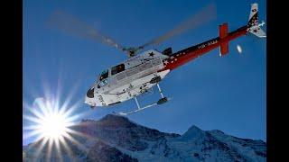 H125 Ecureuil action in fantastic mountain panorama - helicopter airlift Lauberhorn 2024