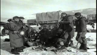 Corporal A W Rasmussen and Corporal J Scott at a water-cooled machine gun as US M...HD Stock Footage