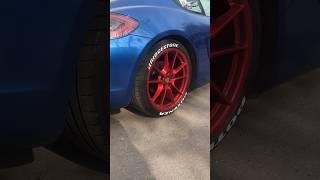 The red wheels grew on me. Porsche cayman.