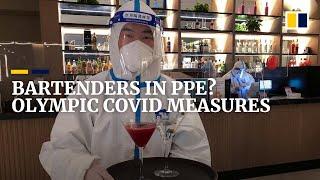 Bartenders wearing hazmat suits? Inside the Beijing Winter Olympic ‘closed loop’ bubble